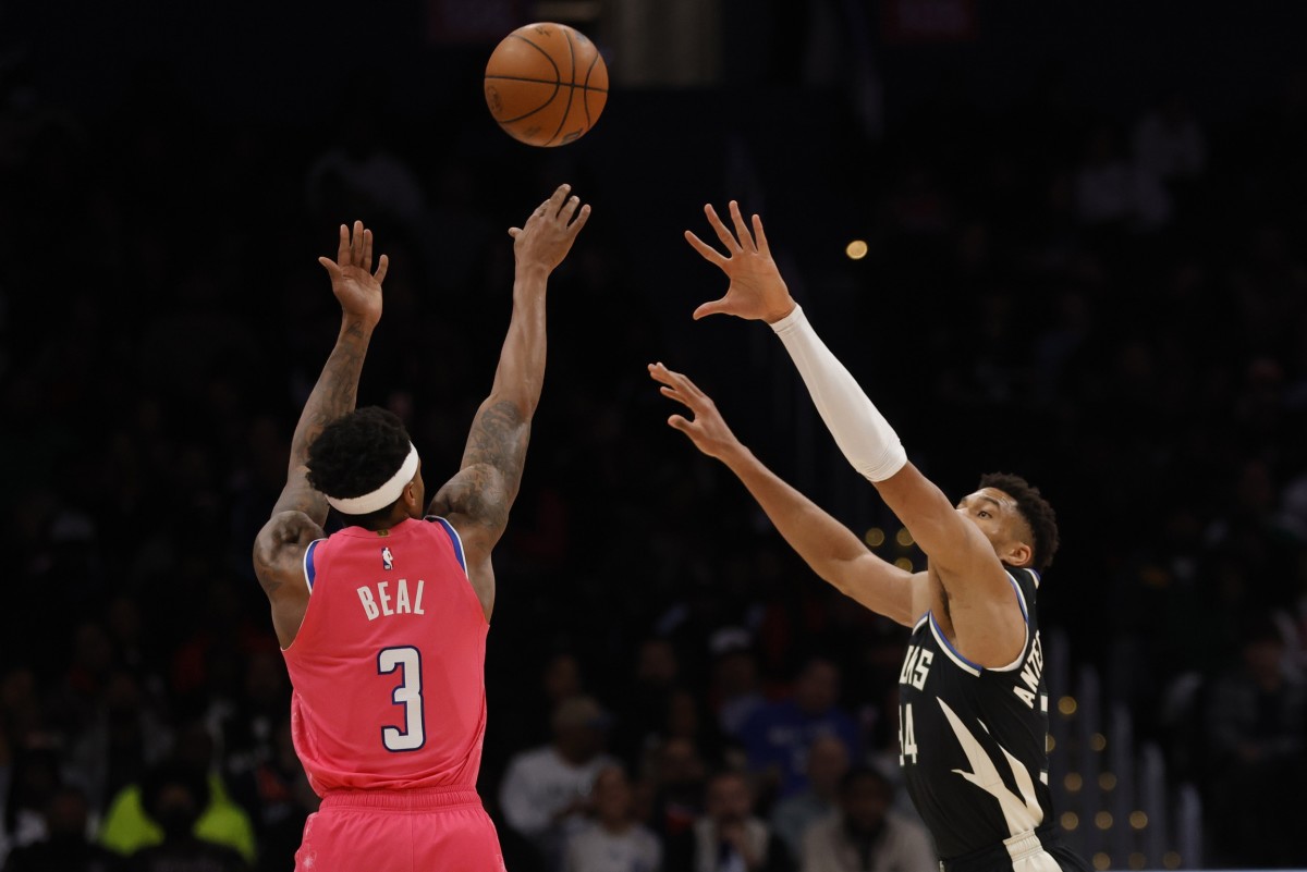 Washington Wizards guard Bradley Beal (3) shoots the ball as Milwaukee Bucks forward Giannis Antetokounmpo (34)