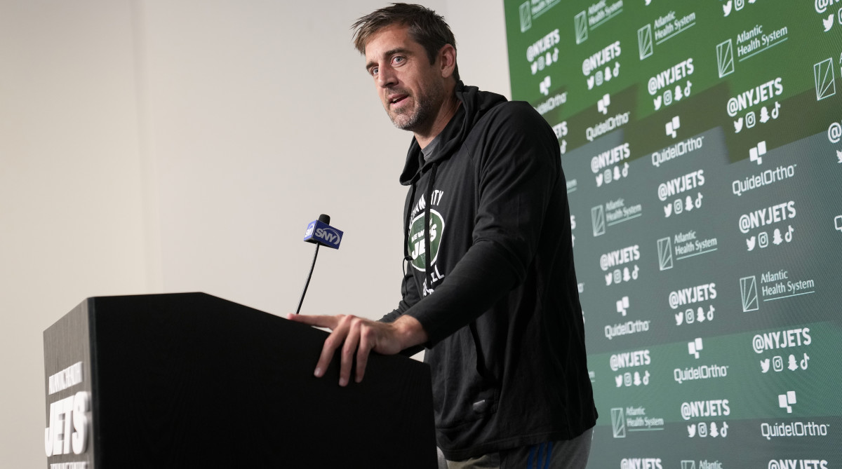 Jets quarterback Aaron Rodgers speaks to members of the media.