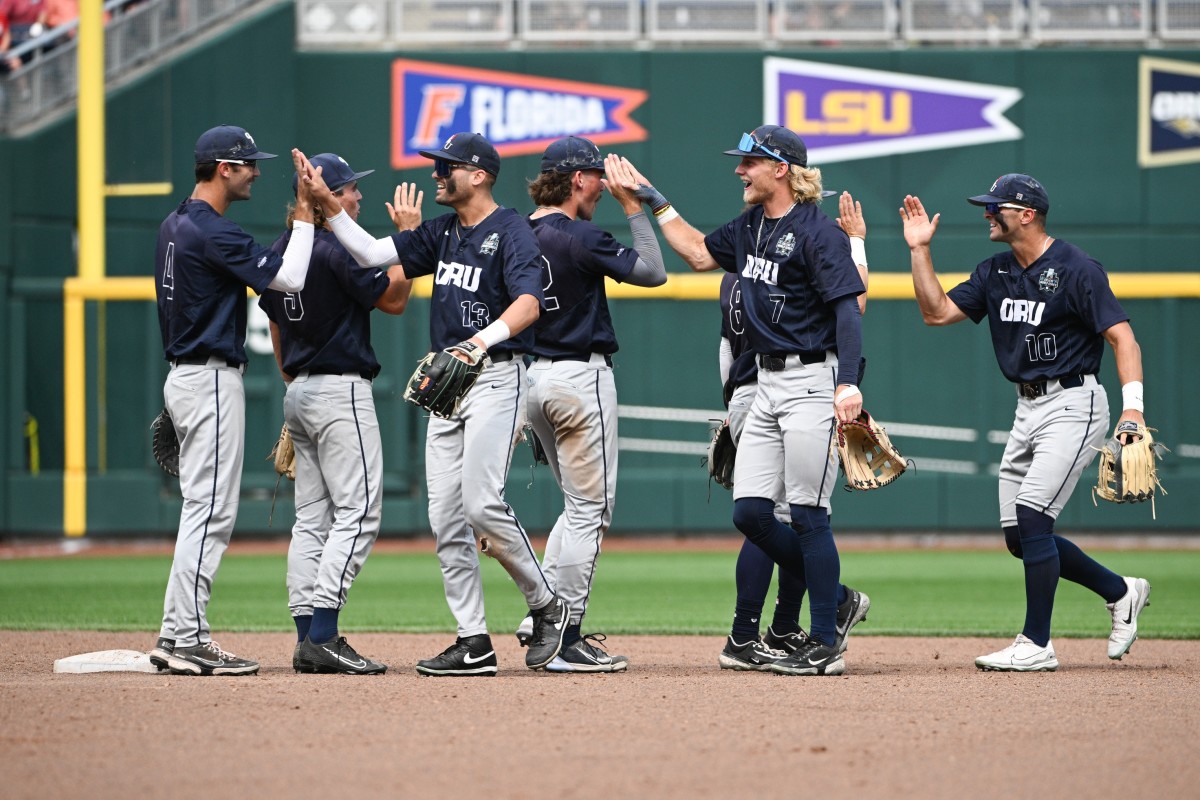 Jun 16, 2023; Omaha, NE, USA; The Oral Roberts Golden Eagles celebrate the win against the TCU Horned Frogs at Charles Schwab Field Omaha.