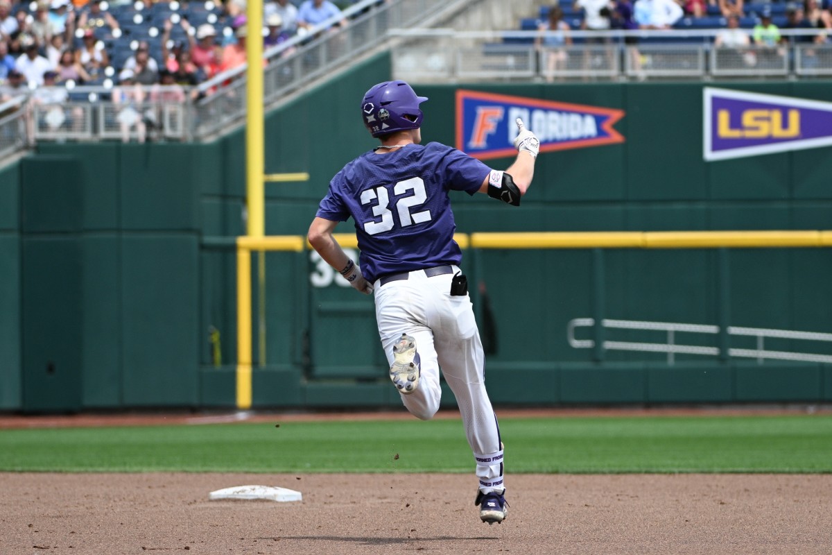 Jun 16, 2023; Omaha, NE, USA; TCU Horned Frogs first baseman Cole Fontenelle (32) signals after hitting a home run against the Oral Roberts Golden Eagles in the fourth inning at Charles Schwab Field Omaha