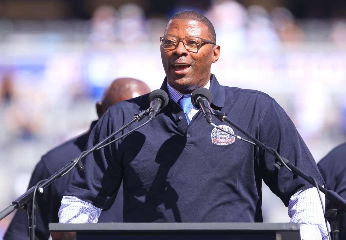 Sep 20, 2015; East Rutherford, NJ, USA; Former New York Giants linebacker Carl Banks speaks on stage during half time ceremony honoring the 25th anniversary of their championship at MetLife Stadium.