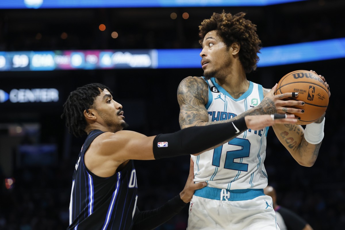 Charlotte Hornets guard Kelly Oubre Jr. (12) looks to pass against Orlando Magic guard Gary Harris (14)