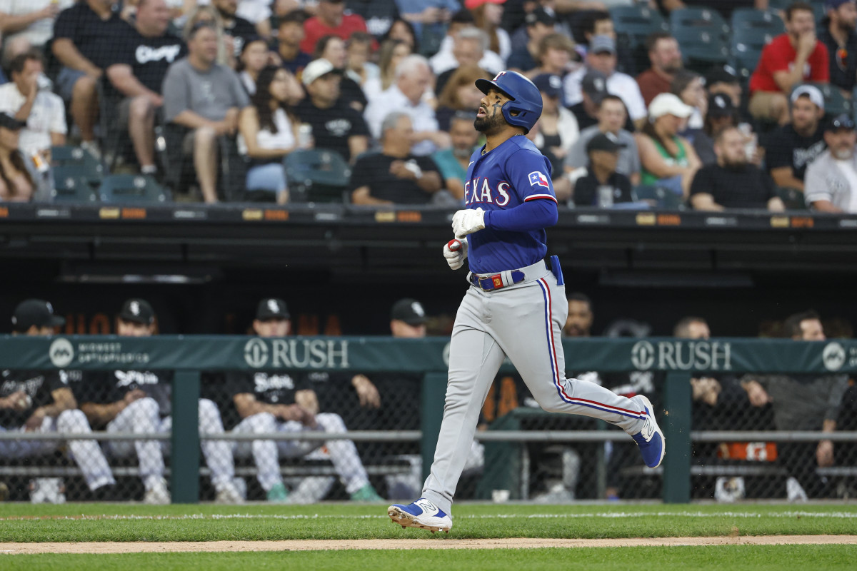 Jun 21, 2023; Chicago, Illinois, USA; Texas Rangers shortstop Ezequiel Duran (20) rounds the bases after hitting a two-run home run against the Chicago White Sox during the fourth inning at Guaranteed Rate Field. Mandatory Credit: Kamil Krzaczynski-USA TODAY Sports