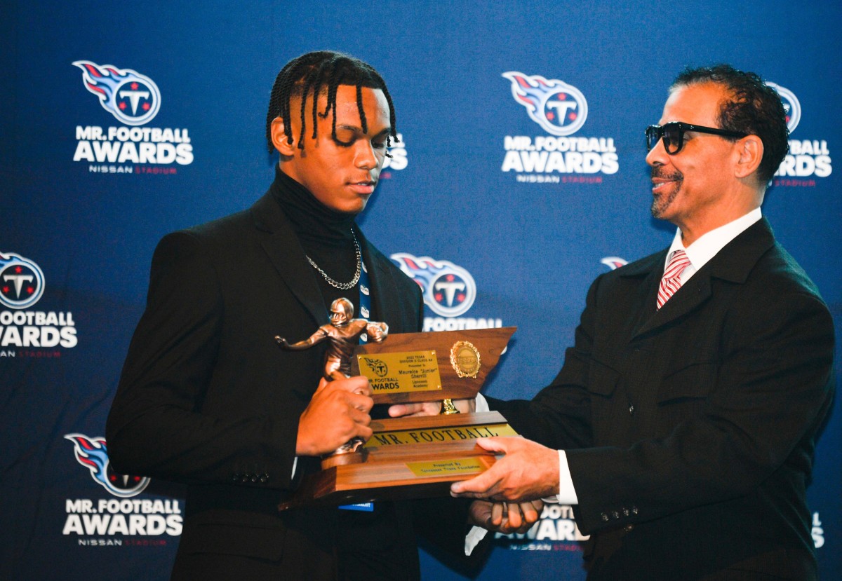 Maurice \"Junior\" Sherrill is given the Division II-Class AA Mr. Football award by former Titan football player, Blaine Bishop, at the luncheon at Nissan Stadium in Nashville, Tenn., Wednesday, Dec. 7, 2022. Mrfootball 22 29