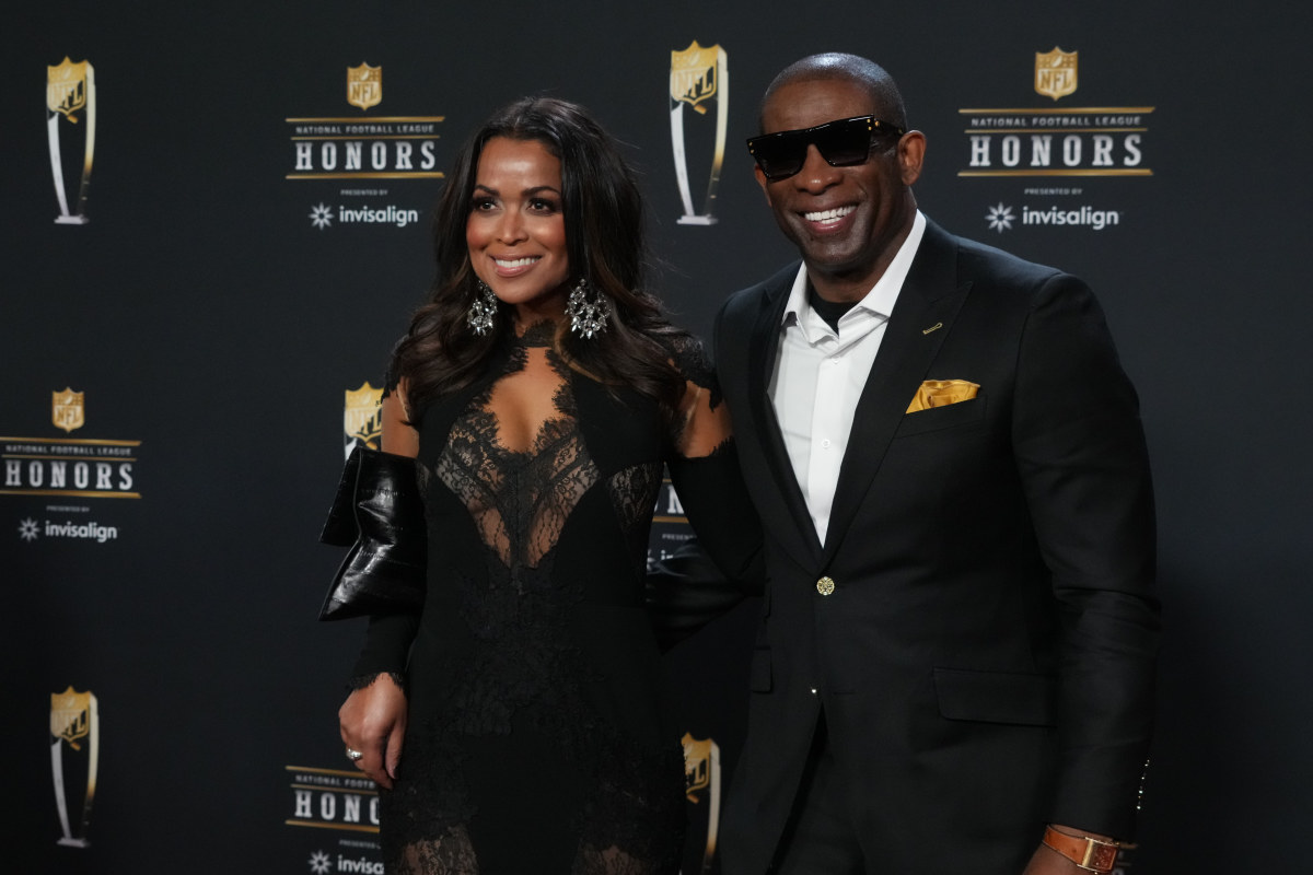 CU Boulder head coach Deion Sanders poses for a photo on the red carpet before the NFL Honors award show at Symphony Hall.