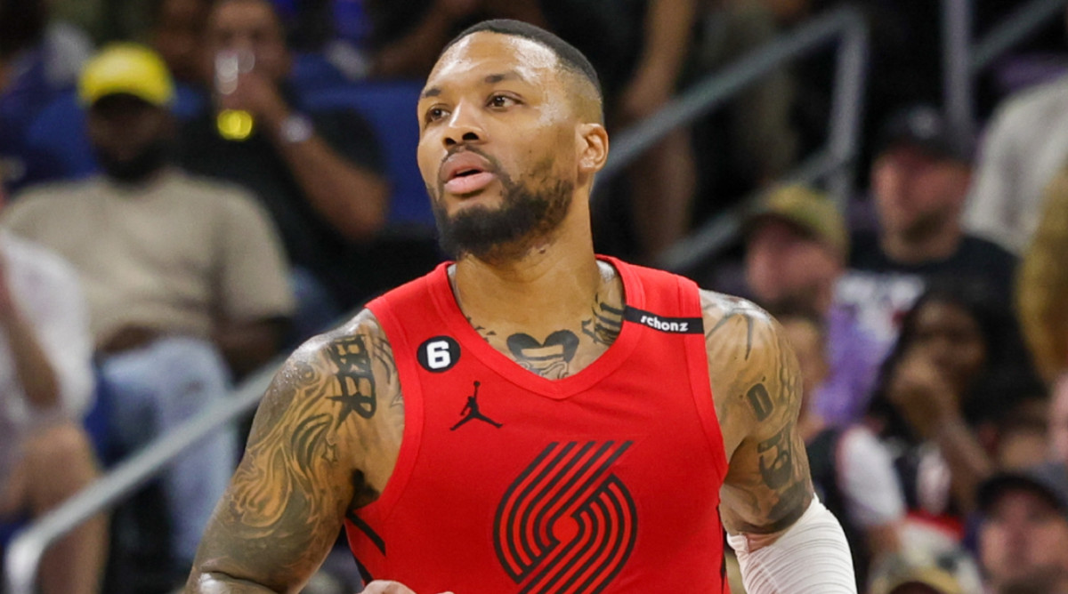 Trail Blazers guard Damian Lillard dribbles the ball.