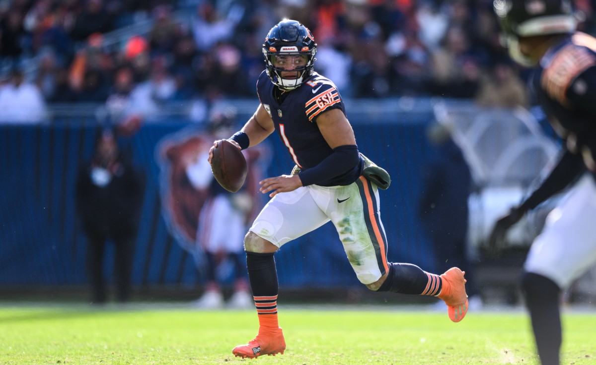 Justin Fields of the Chicago Bears throws a pass during a game