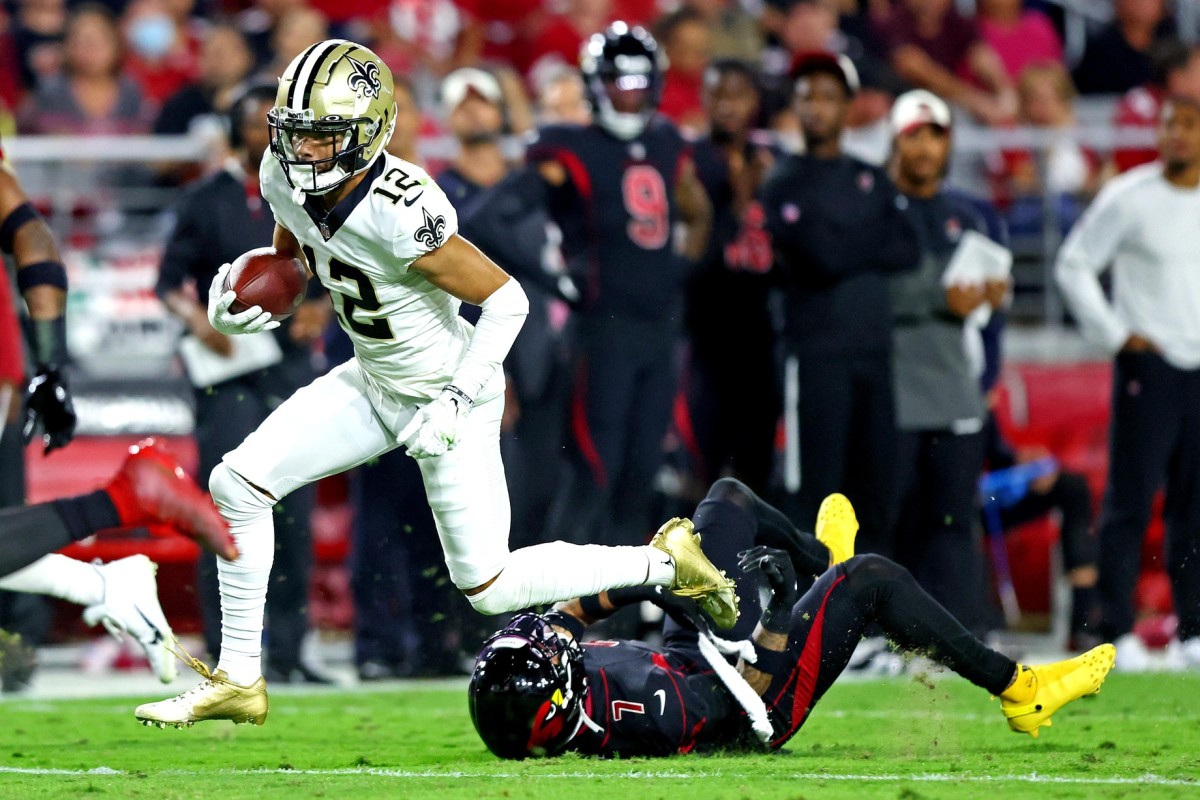 New Orleans Saints wide receiver Chris Olave (12) runs a route during an NFL  football game against the Tampa Bay Buccaneers, Sunday, Sept. 18, 2022, in  New Orleans. (AP Photo/Jonathan Bachman Stock