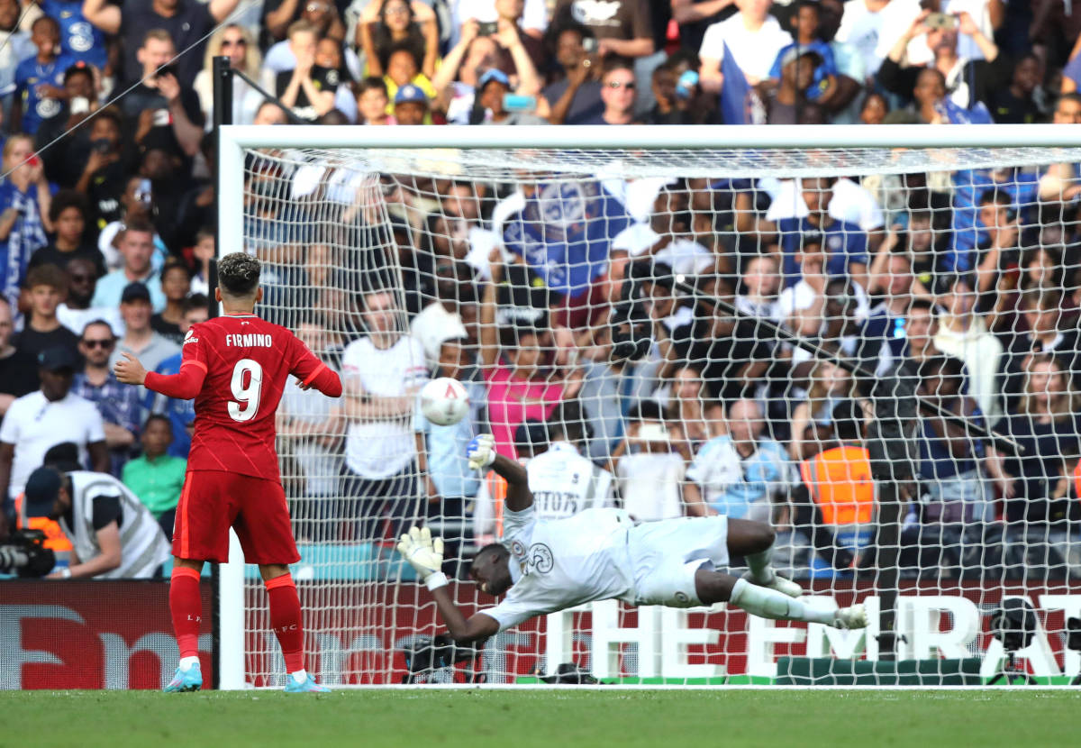 Roberto Firmino pictured scoring past Edouard Mendy during a penalty shootout in the 2022 FA Cup final