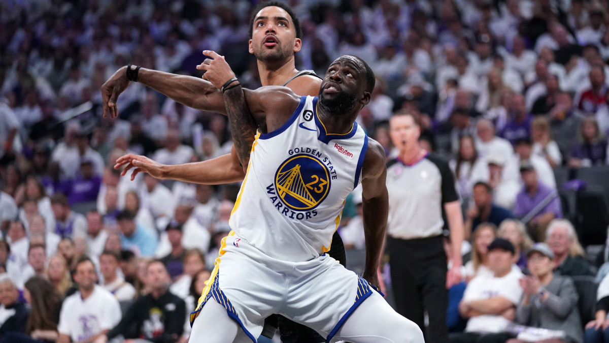 Golden State Warriors forward Draymond Green battles for position with Sacramento Kings forward Trey Lyles.