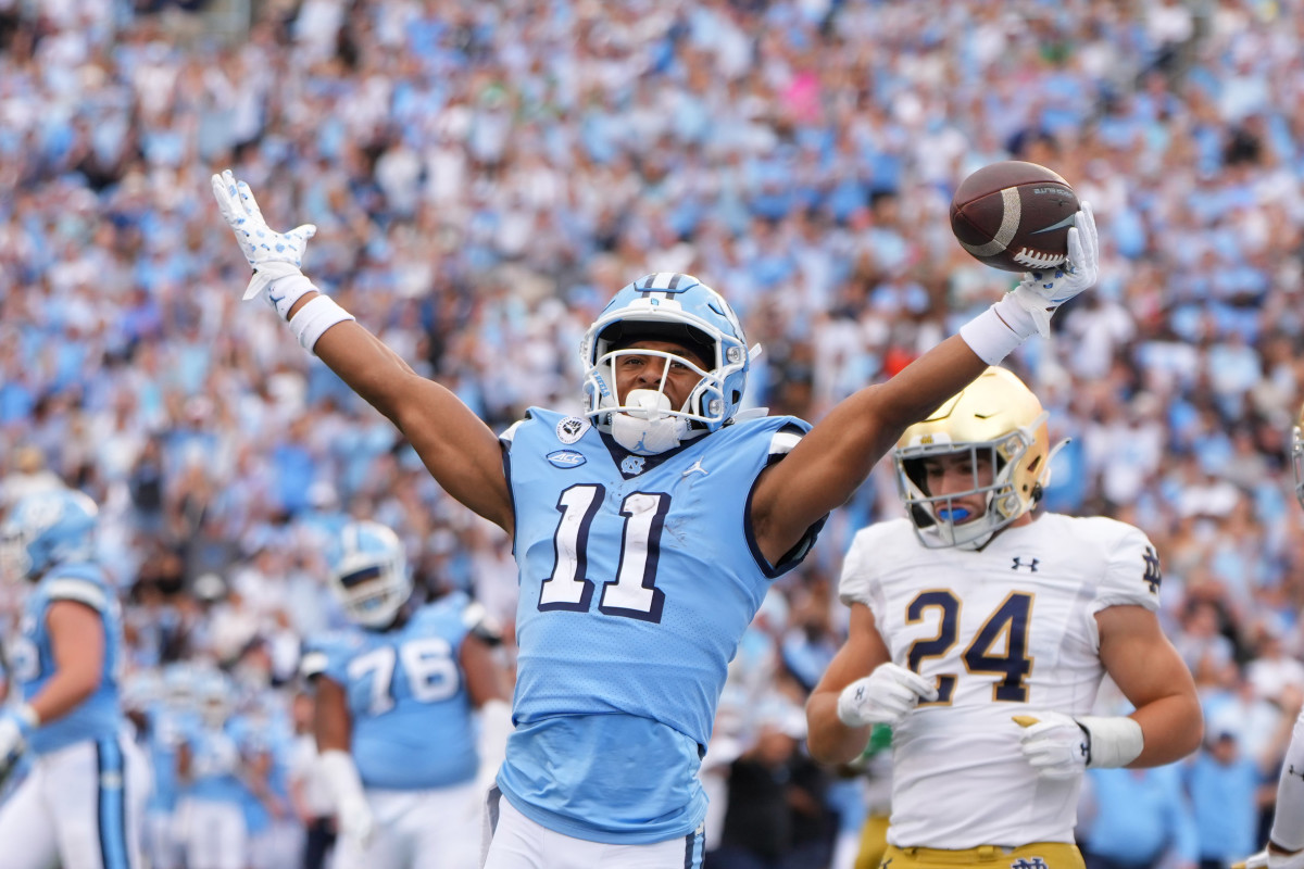 Sep 24, 2022; Chapel Hill, North Carolina, USA; North Carolina Tar Heels wide receiver Josh Downs (11) reacts after scoring a touchdown in the second quarter at Kenan Memorial Stadium. Mandatory Credit: Bob Donnan-USA TODAY Sports