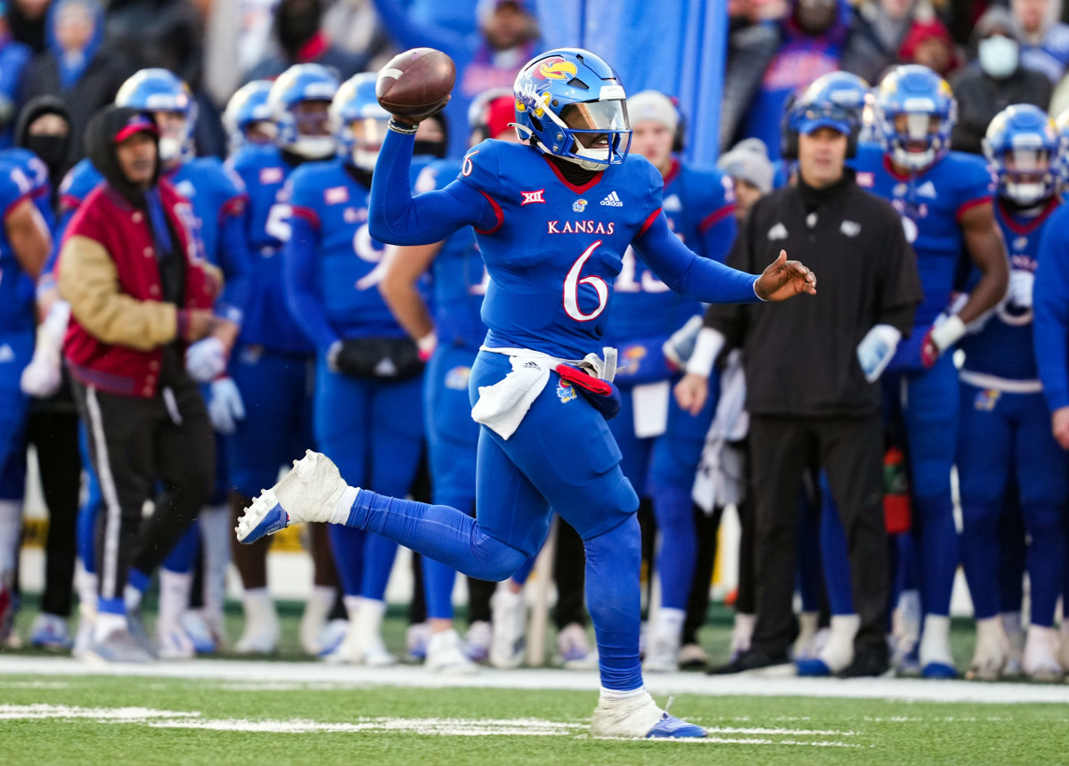 Nov 19, 2022; Lawrence, Kansas, USA; Kansas Jayhawks quarterback Jalon Daniels (6) throws a pass during the first half against the Texas Longhorns at David Booth Kansas Memorial Stadium. Mandatory Credit: Jay Biggerstaff-USA TODAY Sports