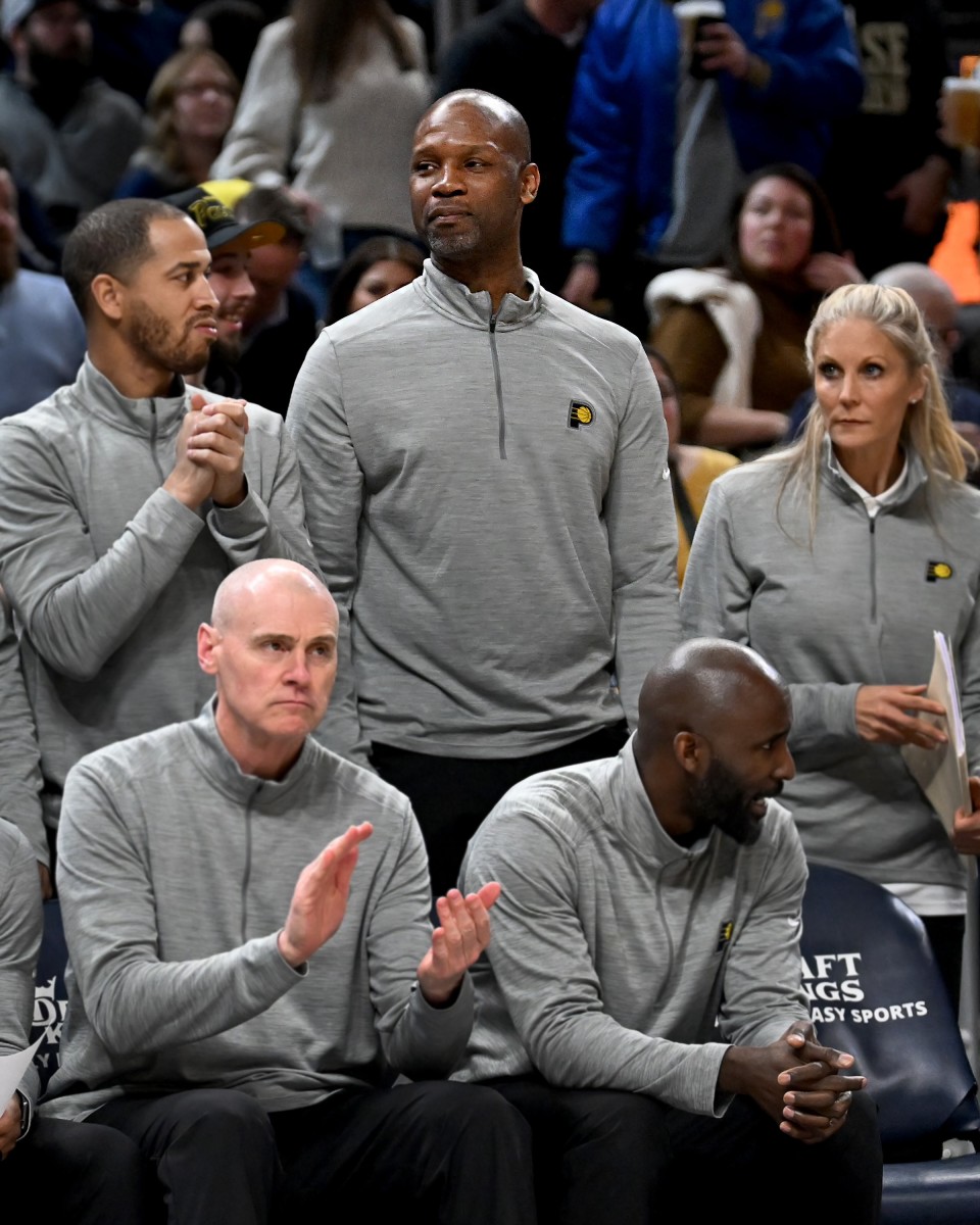 Former Indiana basketball player Calbert Cheaney (back row, middle) spent three seasons in a player development role with the Indiana Pacers.