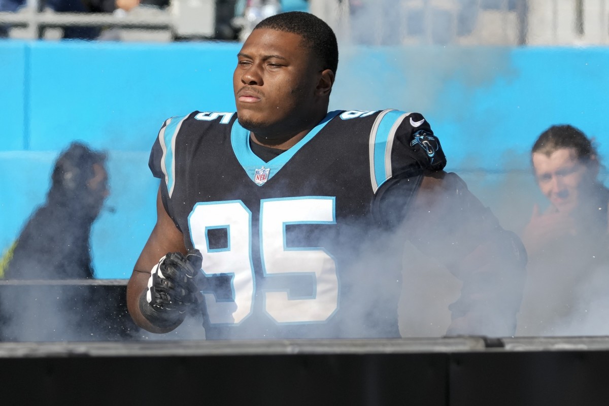 Carolina Panthers defensive tackle Derrick Brown (95) encourages the crowd  to get loud during an NFL football game against the Atlanta Falcons,  Thursday, Nov. 10 2022, in Charlotte, N.C. (AP Photo/Brian Westerholt