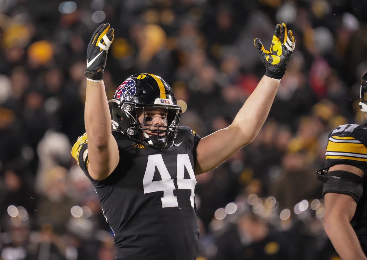 Iowa linebacker Seth Benson fires up the Hawkeyes home crowd in the third quarter against Wisconsin during a NCAA college football game in Iowa City on Saturday, Nov. 12, 2022.