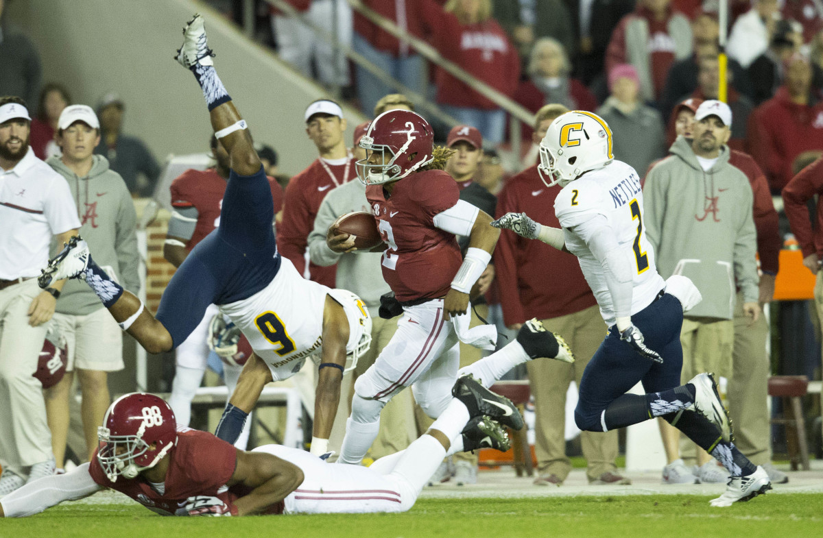 Alabama Crimson Tide quarterback Jalen Hurts (2) carries the ball against the Chattanooga Mocs at Bryant-Denny Stadium in 2016.