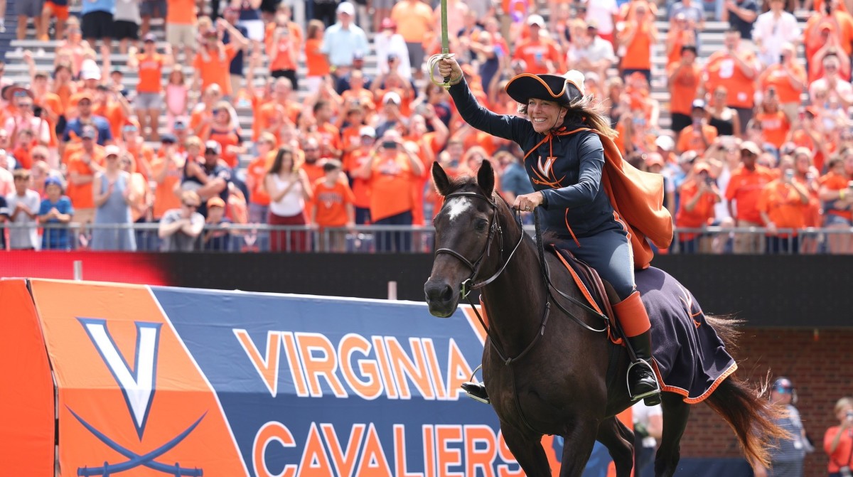 Julie Caruccio rides onto the field as the Cavalier on horseback before the Virginia football game against Richmond at Scott Stadium.