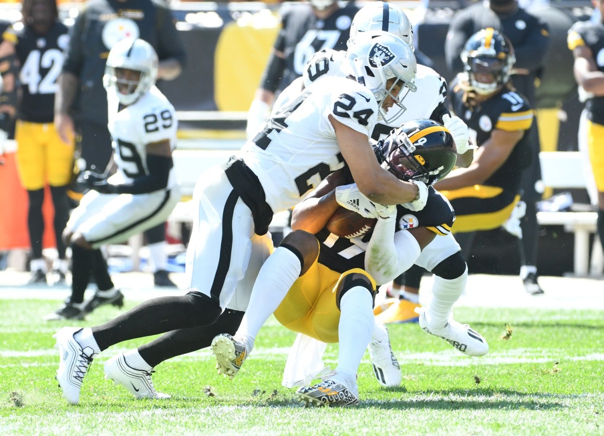 Sep 19, 2021; Raiders safety Jonathan Abram tackles Pittsburgh Steelers receiver JuJu Smith-Schuster after a short gain. Mandatory Credit: Philip G. Pavely-USA TODAY Sports