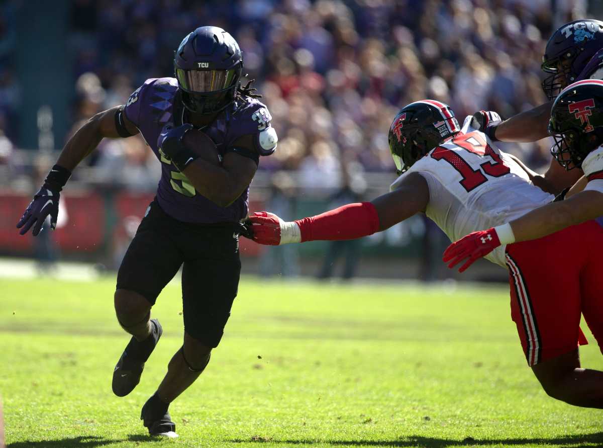 TCU's running back Kendre Miller (33) runs with the ball against Texas Tech.