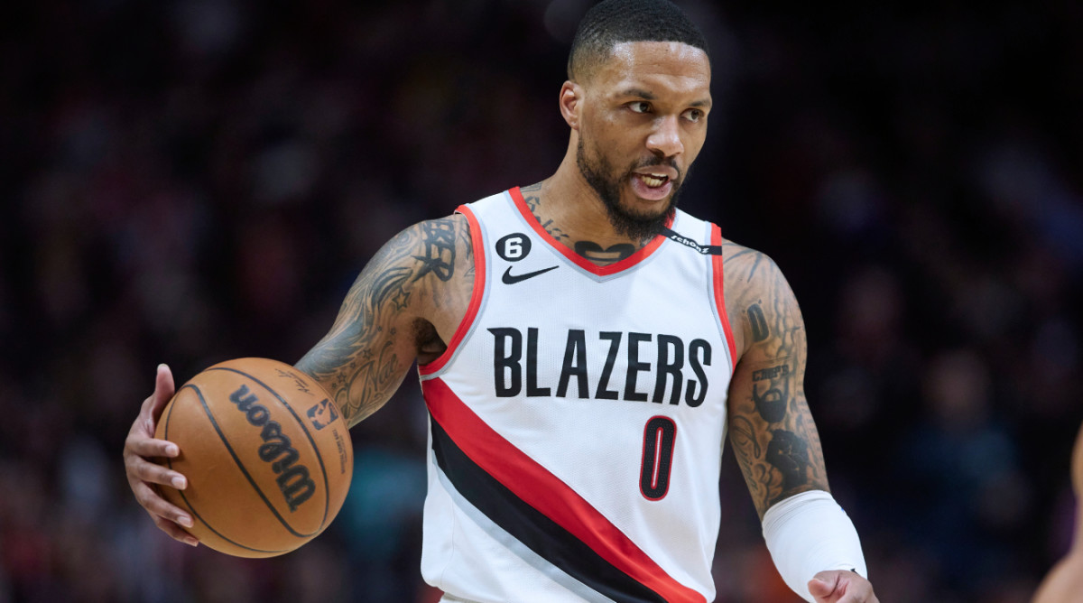 FILE - Portland Trail Blazers guard Damian Lillard brings the ball up against the New York Knicks during the second half of an NBA basketball game in Portland, Ore., Tuesday, March 14, 2023. Damian Lillard asked his team for a trade Saturday, July 1, a person with knowledge of the matter told The Associated Press. (AP Photo/Craig Mitchelldyer, File)