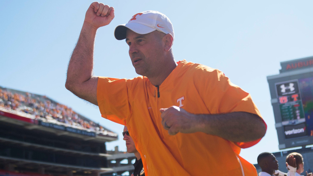 Head Coach Jeremy Pruitt runs off the field after a game between Tennessee and Auburn.