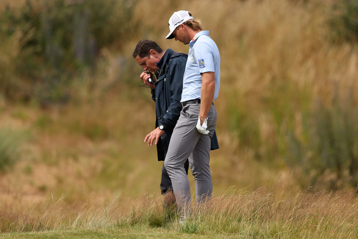 Sam Burns of the United States talks with Miguel Vidaor, DP World Tour rules official for a ruling on the 10th hole during Day Three of the Genesis Scottish Open at The Renaissance Club on July 15, 2023 in United Kingdom.