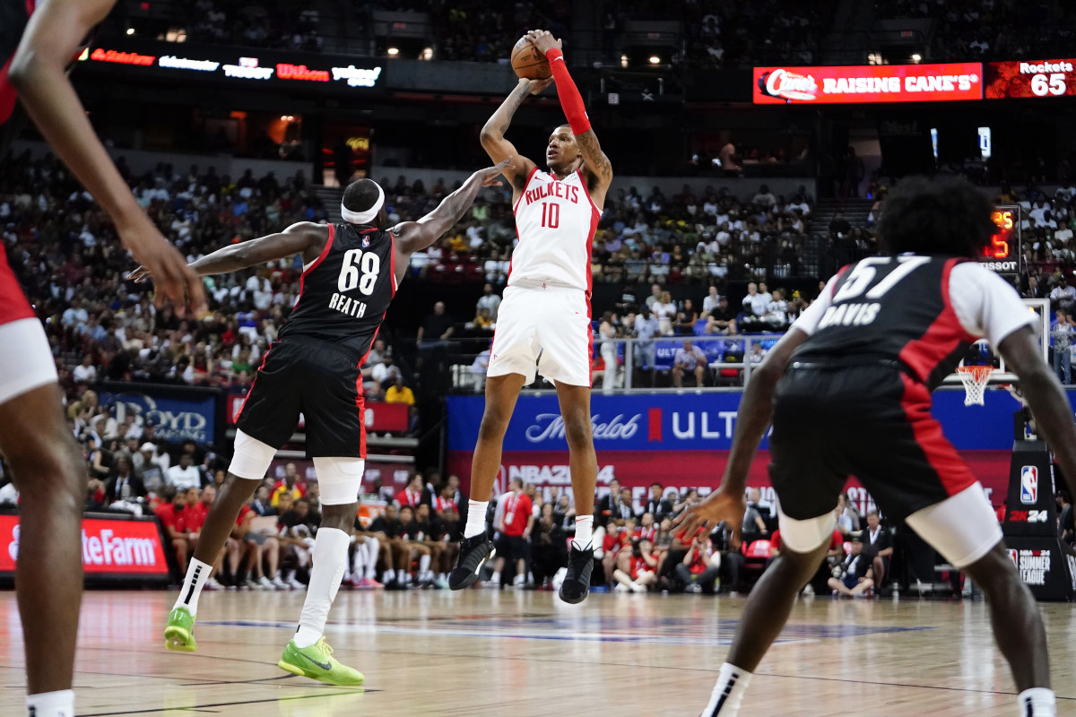 Jul 7, 2023; Las Vegas, NV, USA; Houston Rockets forward Jabari Smith Jr. (10) shoots the ball against Portland Trail Blazers center Duop Reath (68) during the second half at Thomas & Mack Center. Mandatory Credit: Lucas Peltier-USA TODAY Sports