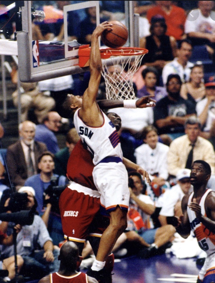 Kevin Johnson throws down against Hakeem Olajuwon.