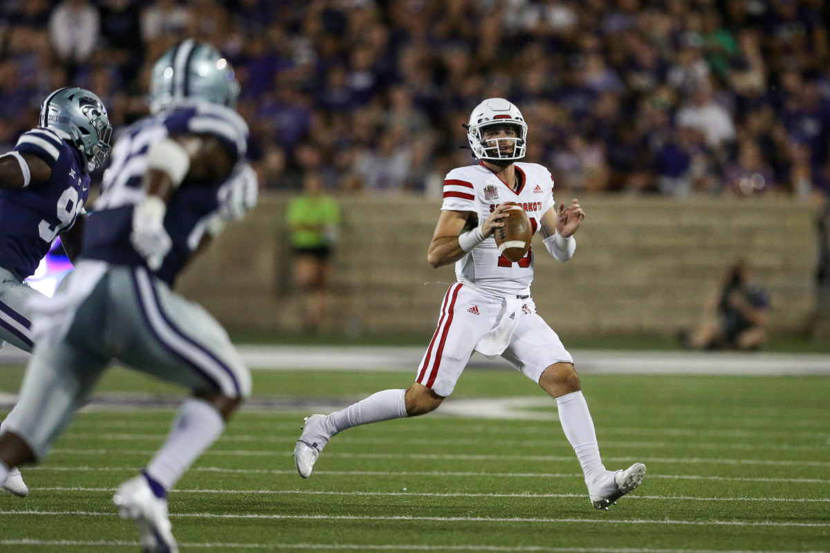 Sep 3, 2022; Manhattan, Kansas, USA; South Dakota Coyotes quarterback Carson Camp (18) scrambles during the third quarter against the Kansas State Wildcats at Bill Snyder Family Football Stadium. Mandatory Credit: Scott Sewell-USA TODAY Sports