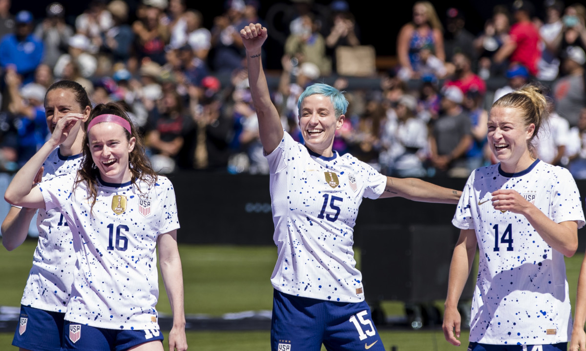 USWNT forward Megan Rapinoe celebrates with her teammates during the send-off celebrations after a game against Wales.