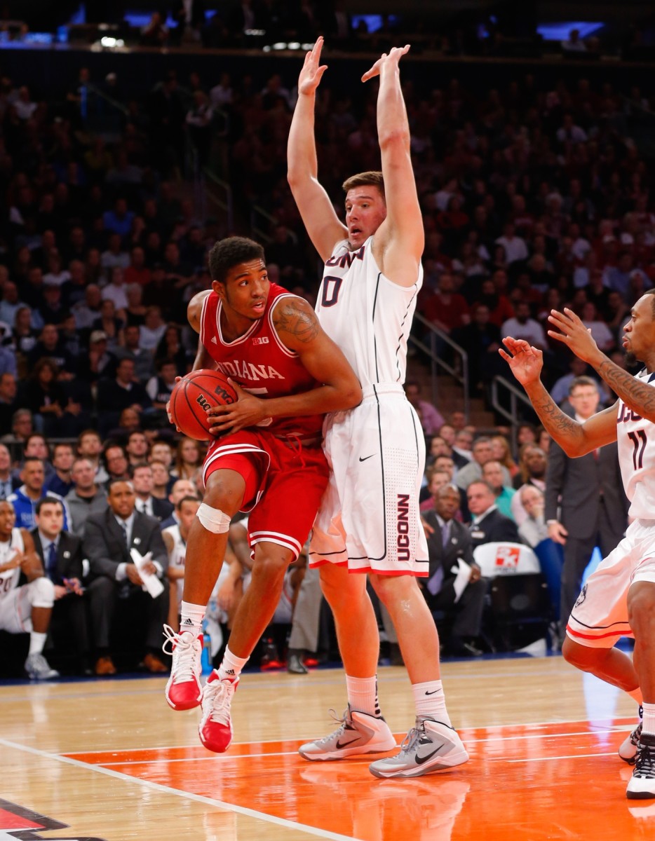 Indiana Hoosiers forward Devin Davis (15) works the base line against Connecticut Huskies forward Tyler Olander (10) during the first half at Madison Square Garden.