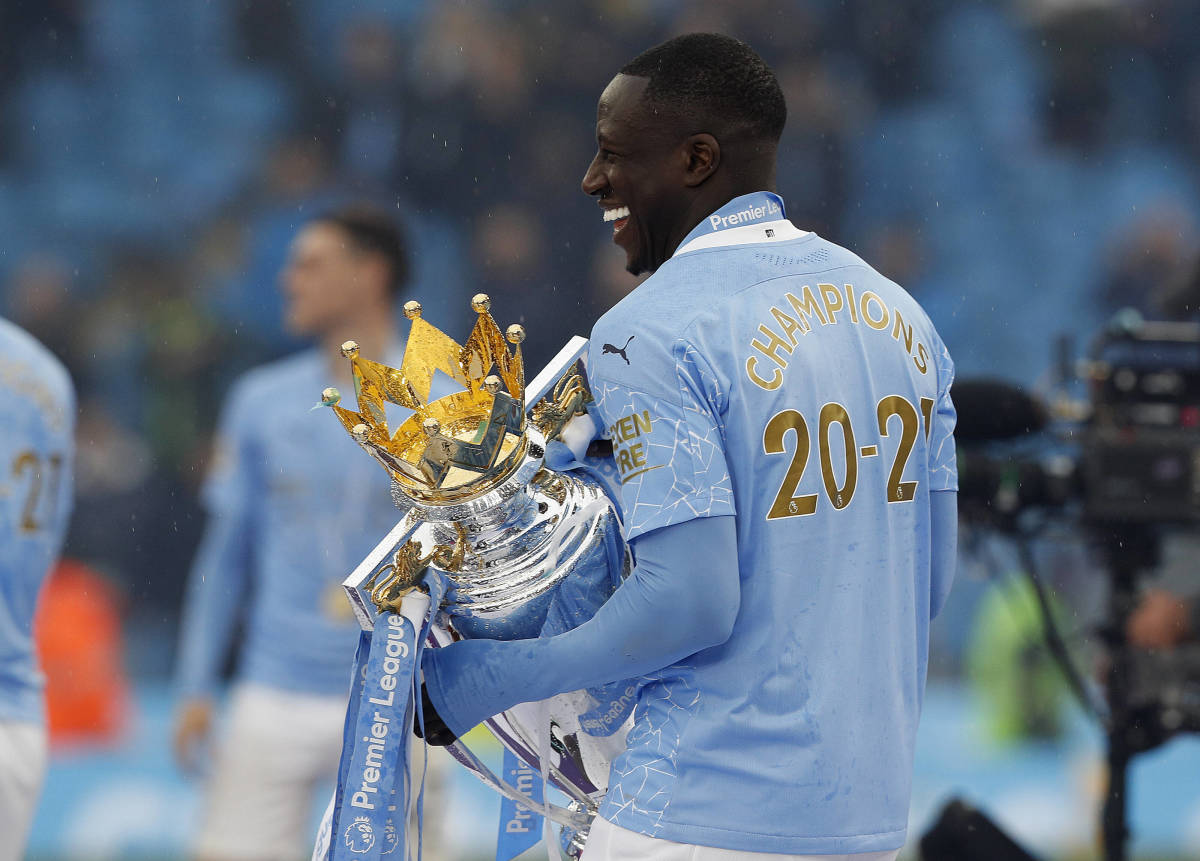 Benjamin Mendy pictured in May 2021 holding the Premier League trophy after featuring in 13 games during Manchester City's title-winning campaign