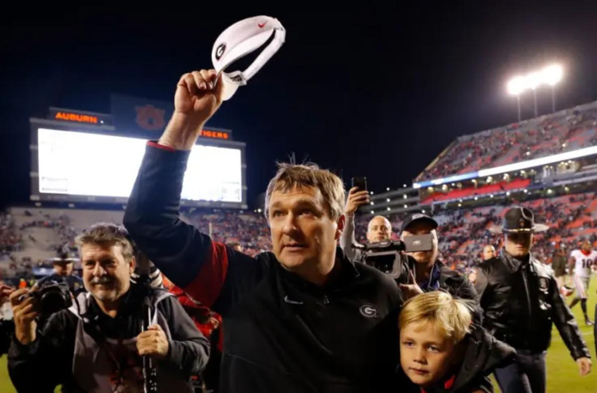 Kirby Smart celebrates a win over Auburn at Jordan-Hare Stadium with his youngest son Andrew.