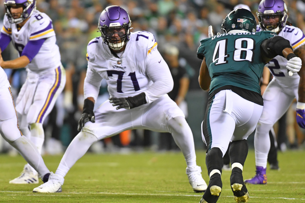 Minnesota Vikings offensive tackle Vederian Lowe leaves the field