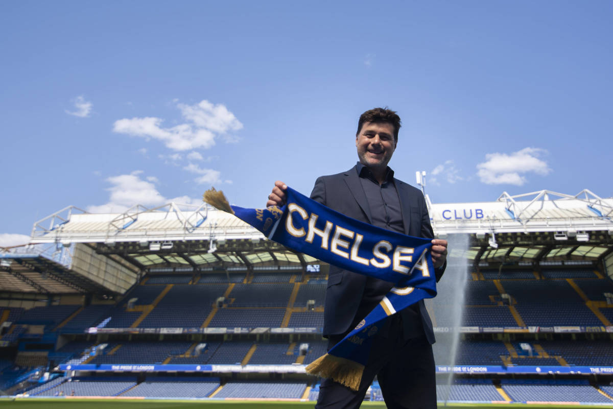 Mauricio Pochettino pictured holding up a Chelsea scarf at Stamford Bridge shortly after being appointed as the club's new manager in July 2023