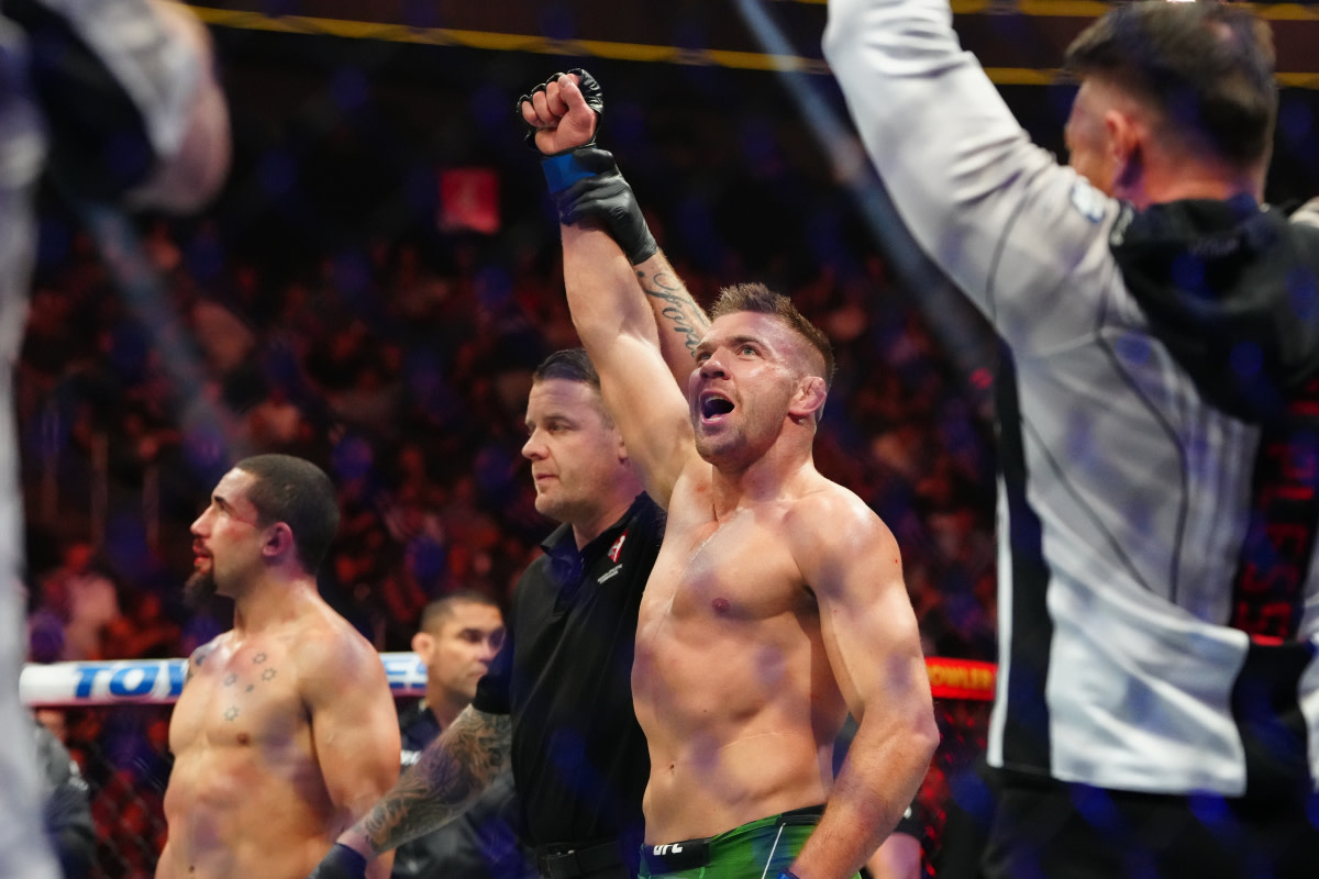 Dricus du Plessis has his hand raised after scoring a second-round TKO finish over Robert Whittaker at UFC 290.