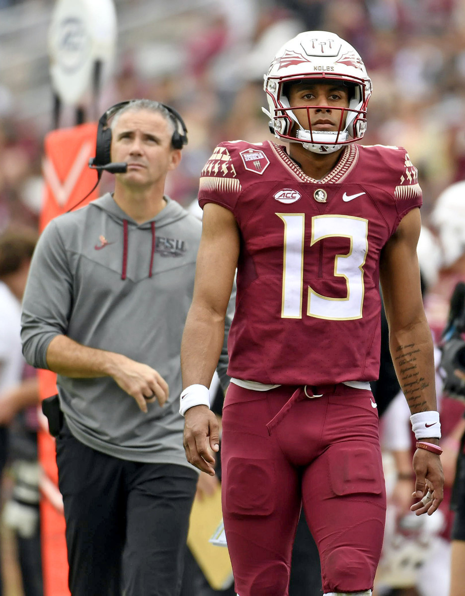 Oct 29, 2022; Tallahassee, Florida, USA; Florida State Seminoles quarterback Jordan Travis and head coach Mike Norvell during the second half against the Georgia Tech Yellow Jackets at Doak S. Campbell Stadium