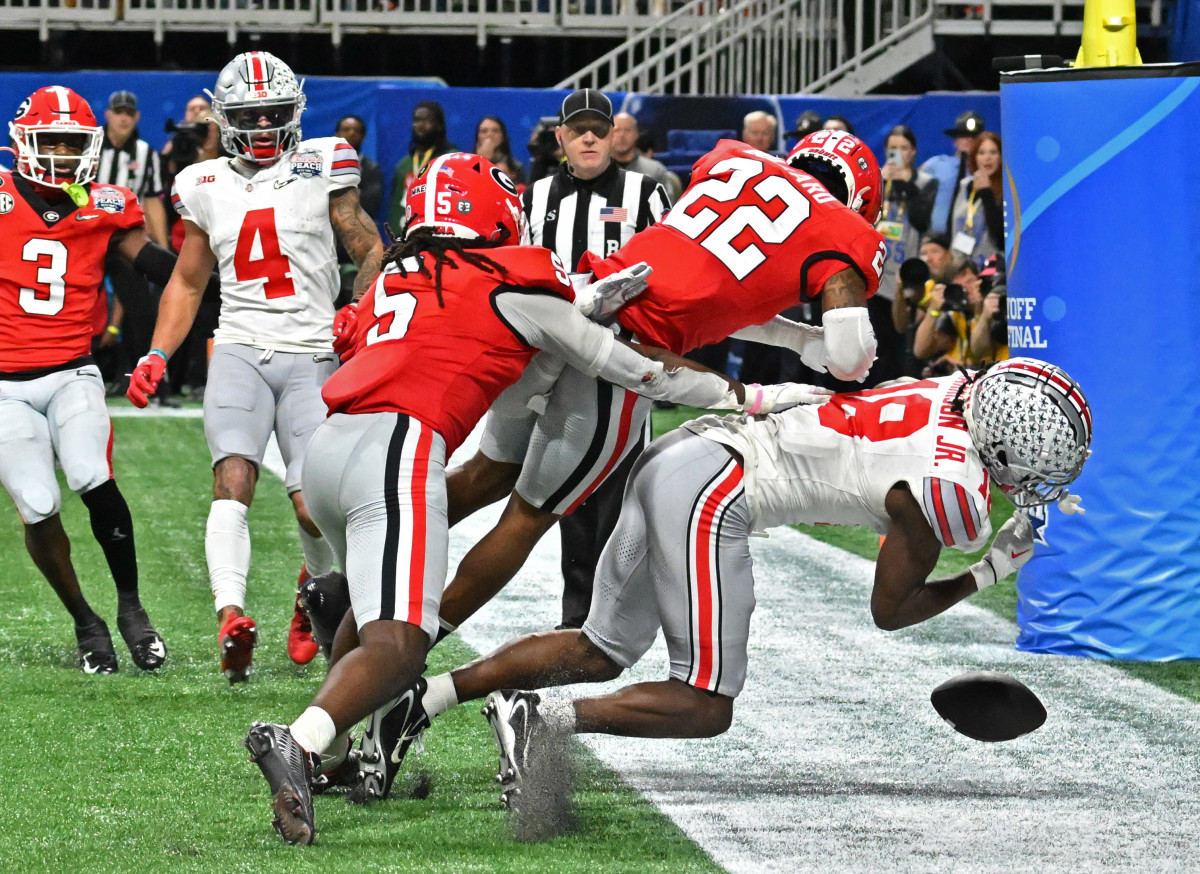 Javon Bullard (22) delivers a devastating blow to Ohio State WR Marvin Harrison Jr. in the 2022 Peach Bowl. Bullard is making the transition from STAR to safety this season.