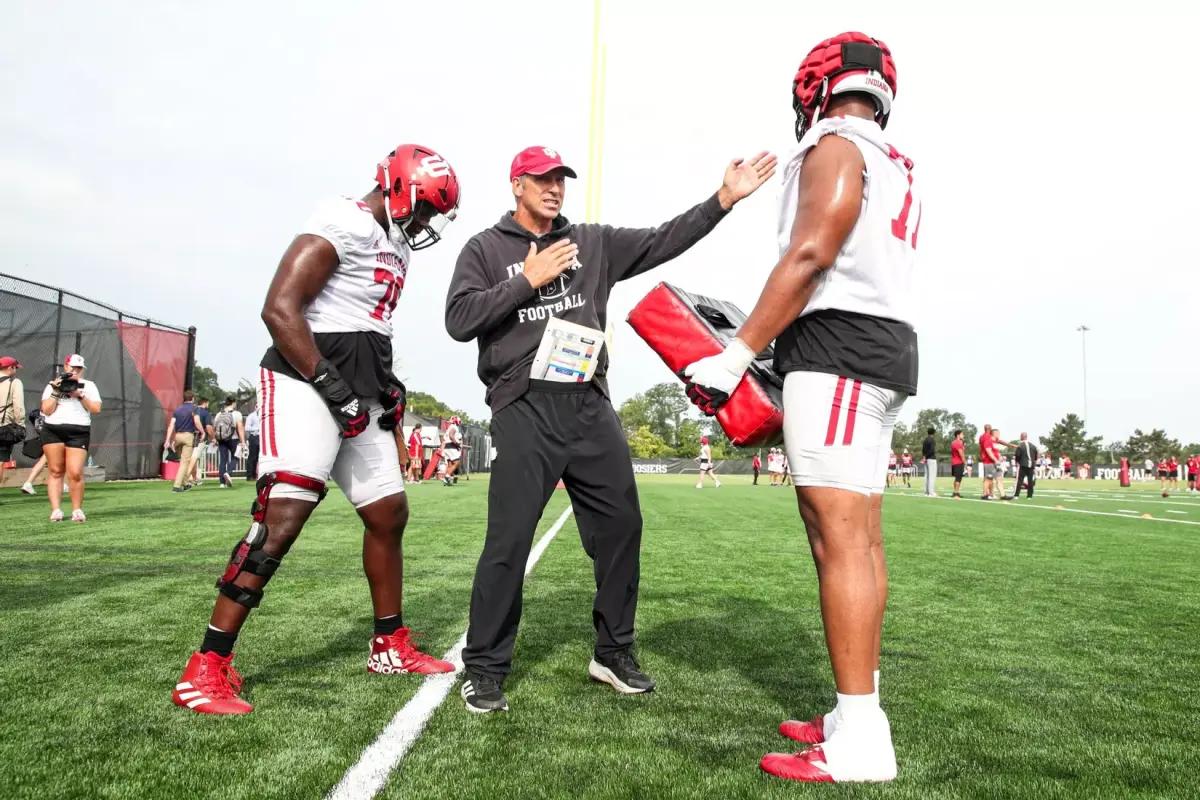 New Indiana offensive line coach and run game coordinator Bob Bostad teaches the Hoosiers during fall camp on Wednesday.