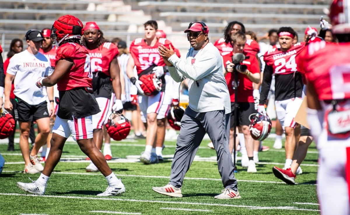 Indiana defensive line coach Paul Randolph congratulates the defense on winning the scrimmage during Indiana football's Spring Football Saturday event at Memorial Stadium on Saturday, April 15, 2023.