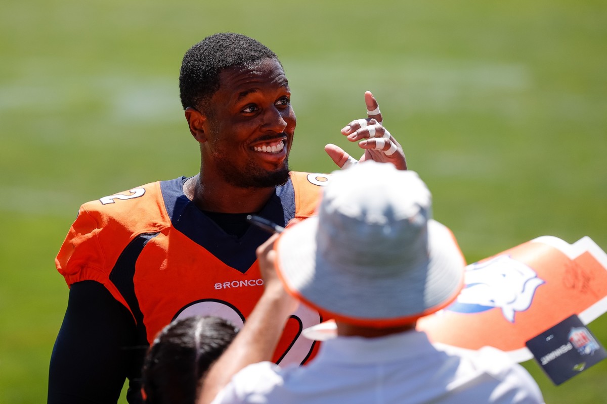 Denver Broncos defensive tackle Jonathan Harris (92) greets fans after training camp at Centura Health Training Center.