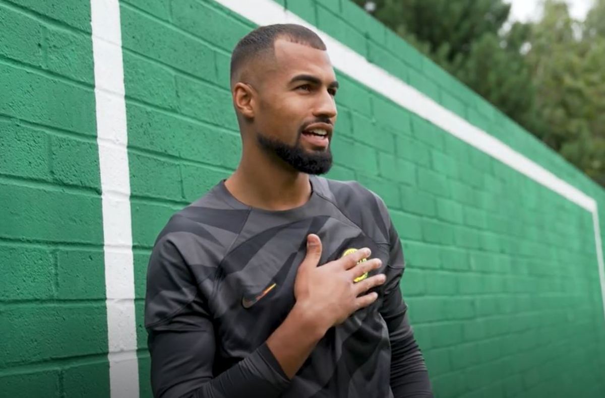 Goalkeeper Robert Sanchez pictured touching the Chelsea club crest on his new jersey after completing a transfer from Brighton in August 2023