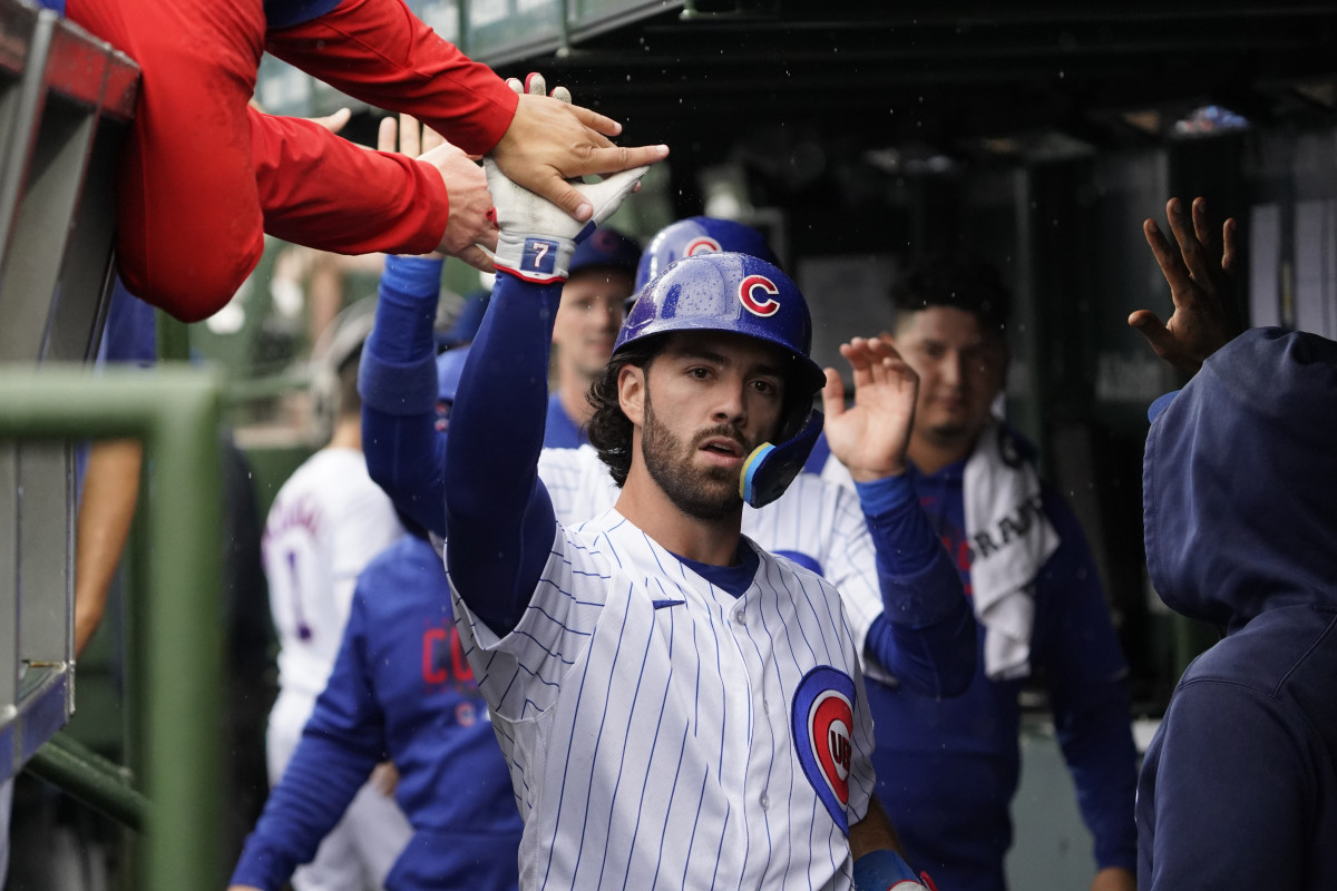 Aug 5, 2023; Chicago, Illinois, USA; Chicago Cubs shortstop Dansby Swanson (7) is greeted in the dugout after hitting a two-run home run against the Atlanta Braves during the first inning at Wrigley Field.