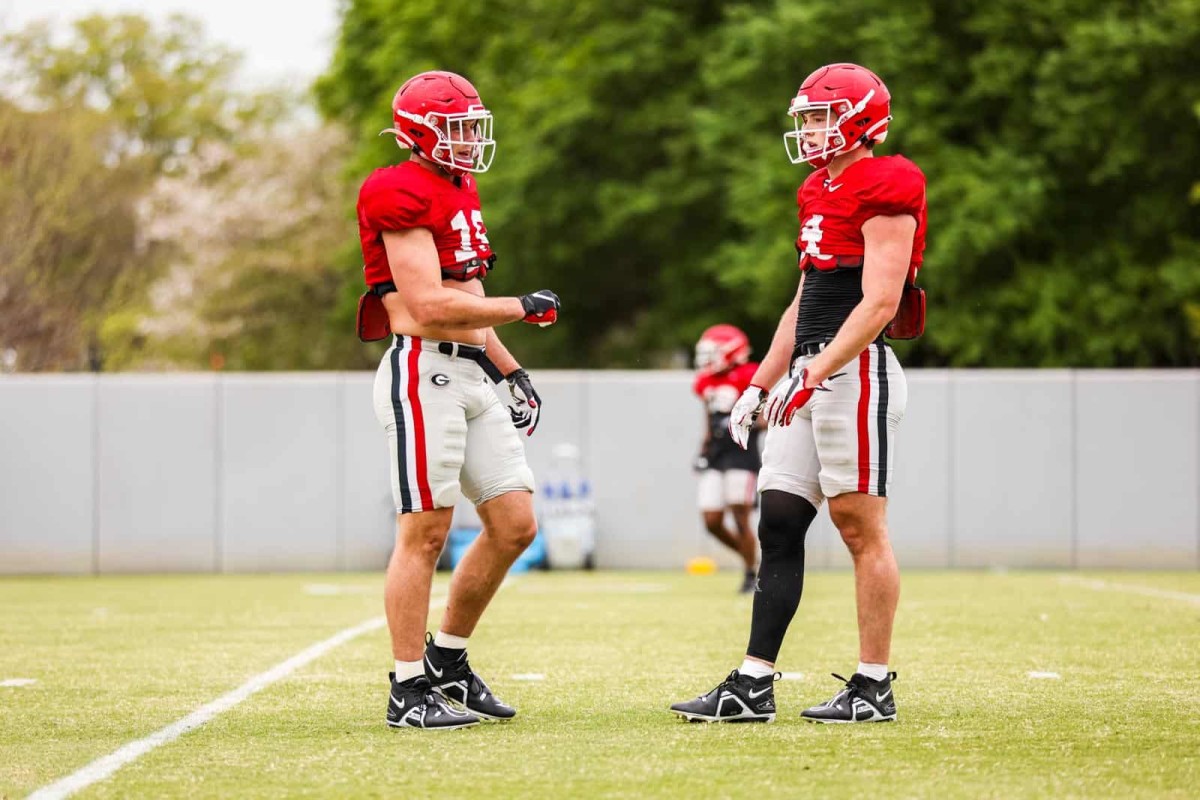 Georgia Tight Ends Brock Bowers (19) and Oscar Delp (4) communicate between reps at a Georgia football practice. Photo Tony Walsh / UGAA