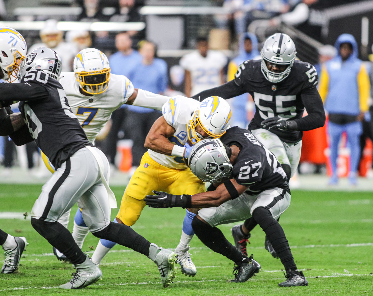 Las Vegas Raiders cornerback Sam Webb (27) tackles Seattle