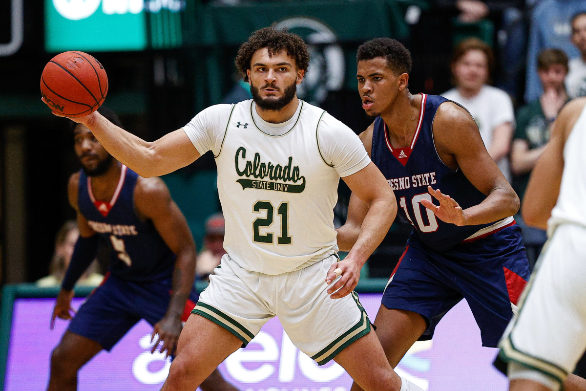 Colorado State Rams guard David Roddy (21) controls the ball as Fresno State Bulldogs forward Orlando Robinson (10) guards in the first half at Moby Arena.