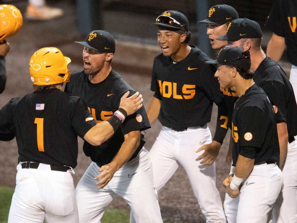 Tennessee's Drew Gilbert (1) is greeted by Luc Lipcius (40) and the team as they celebrate their runs against Georgia Tech in the NCAA Knoxville Regional baseball championship against in Knoxville, Tenn. on Sunday, June 5, 2022.