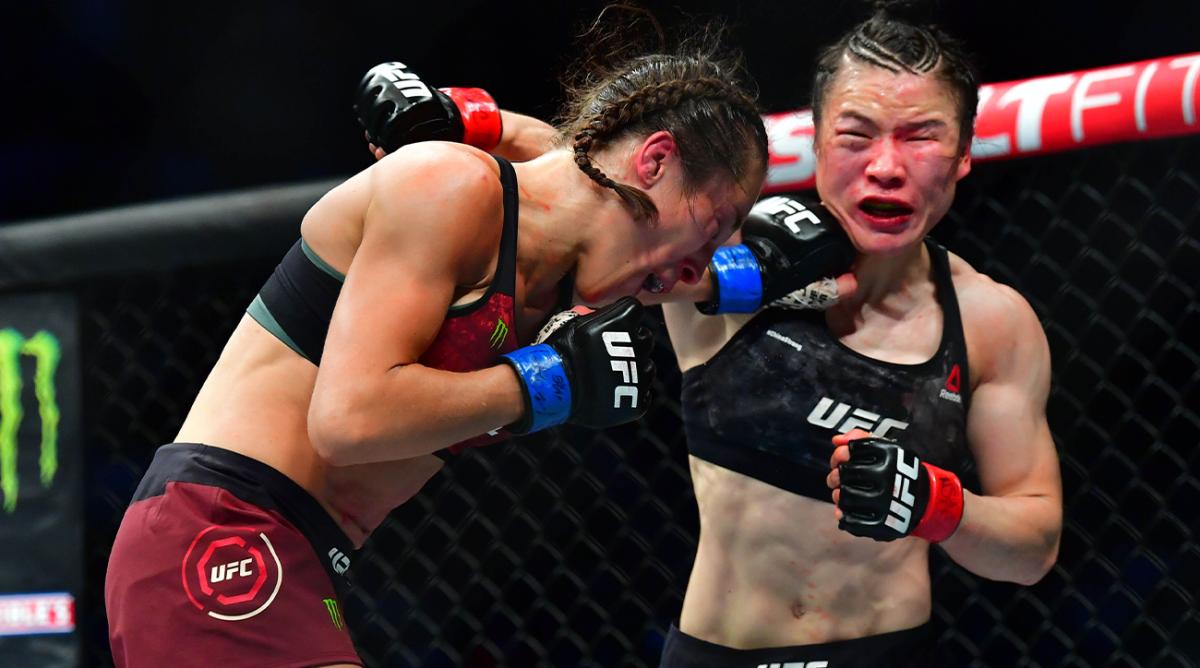 Mar 7, 2020; Las Vegas, Nevada, USA; Weili Zhang (red gloves) fights Joanna Jedrzejczyk (blue gloves) during UFC 248 at T-Mobile Arena