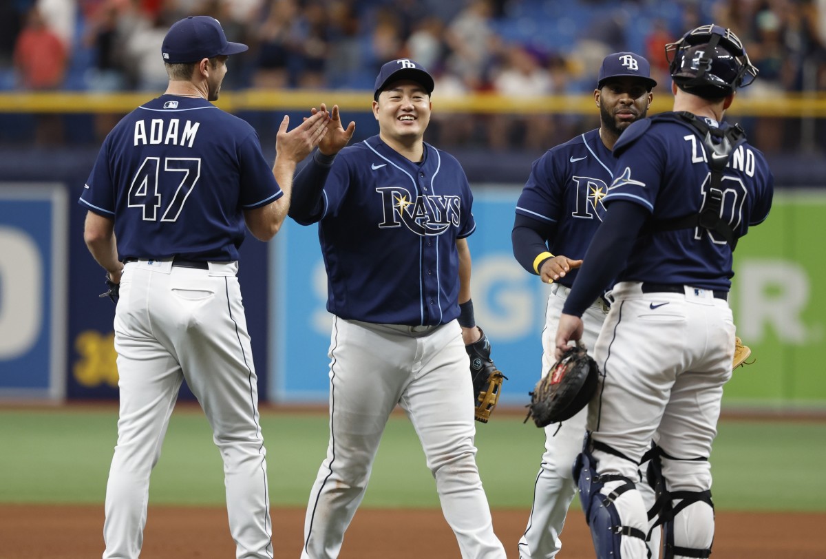 Tampa Bay Rays first baseman Ji-Man Choi (26), Tampa Bay Rays relief pitcher Jason Adam (47) and teammates high five as they beat the St. Louis Cardinals at Tropicana Field. (Kim Klement-USA TODAY Sports)