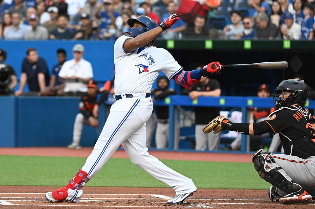 Jordan Romano of the Toronto Blue Jays walks back to the dugout